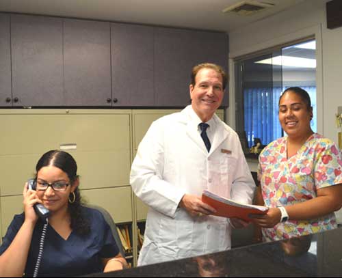 Dr. Taller with staff